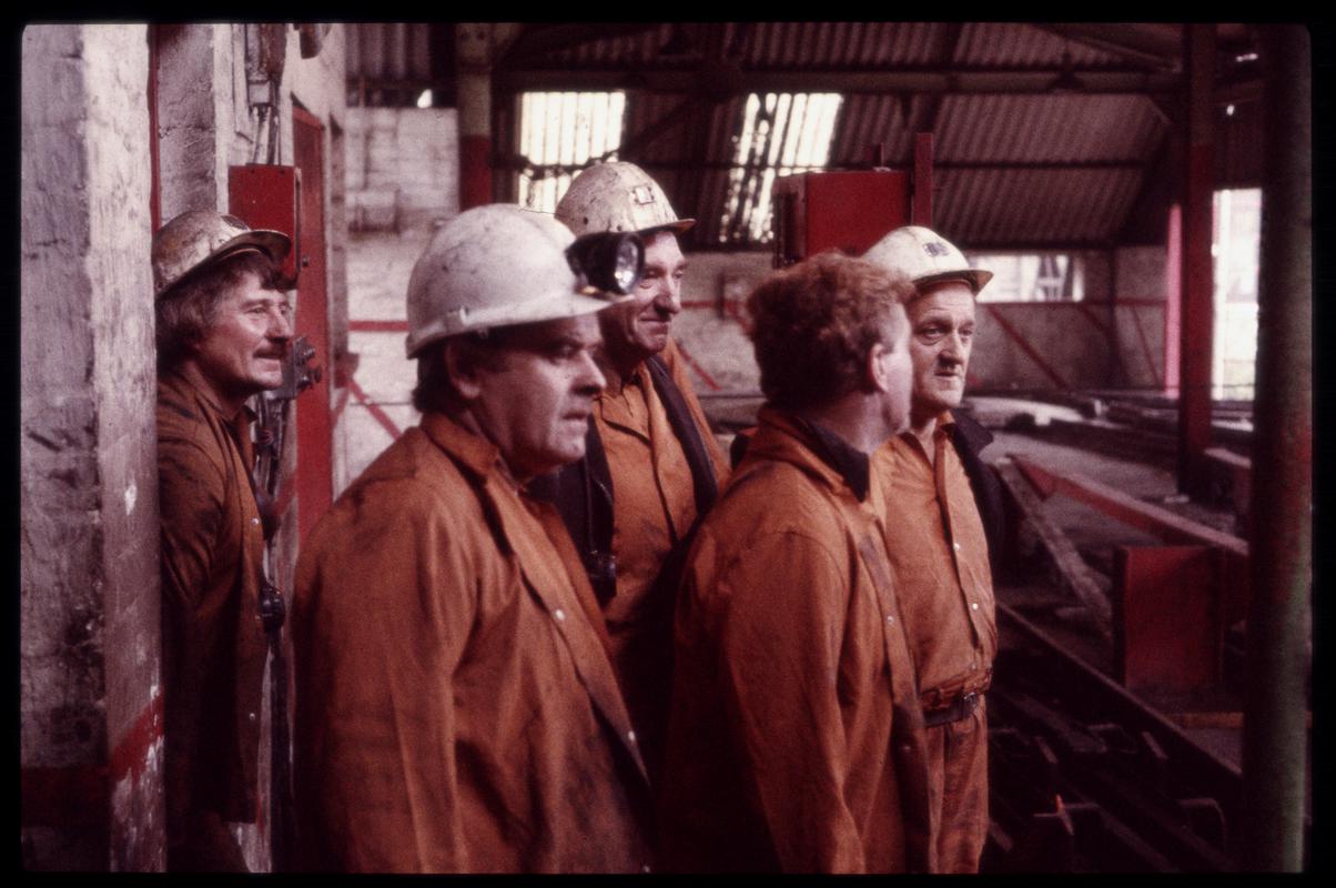 Five miners at the ?upcast shaft pit top area, Lewis Merthyr Colliery.