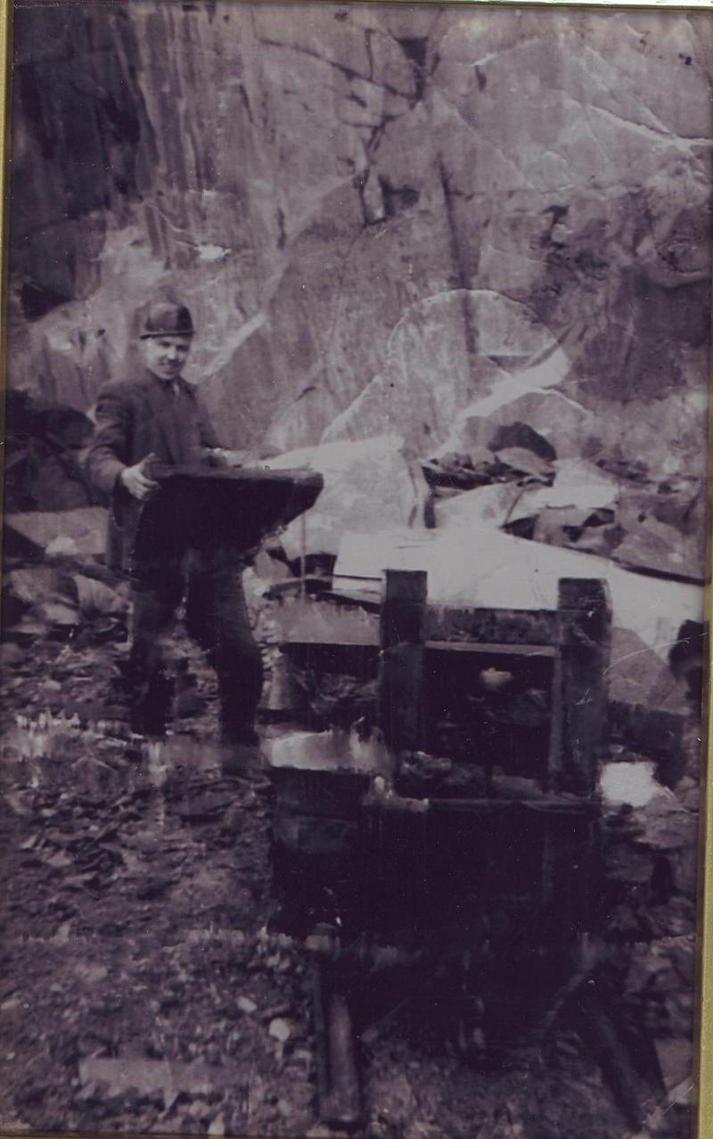 Quarryman lifting a large slab of slate, Dinorwig slate quarry