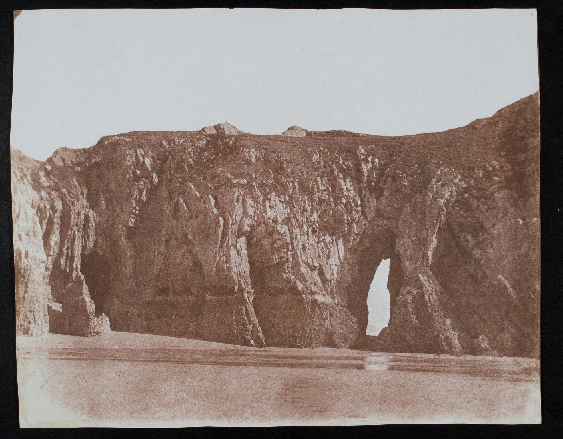 Rock arch in cliff, photograph