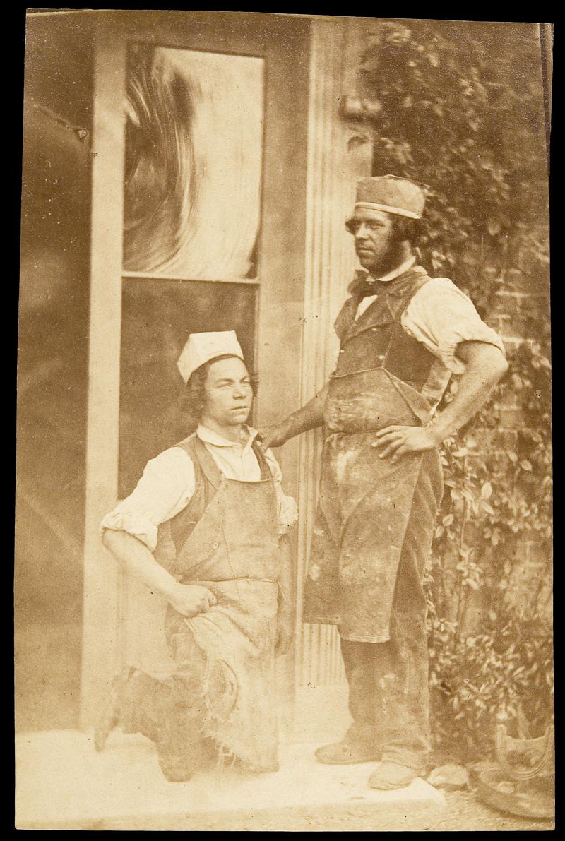 Two workmen with aprons