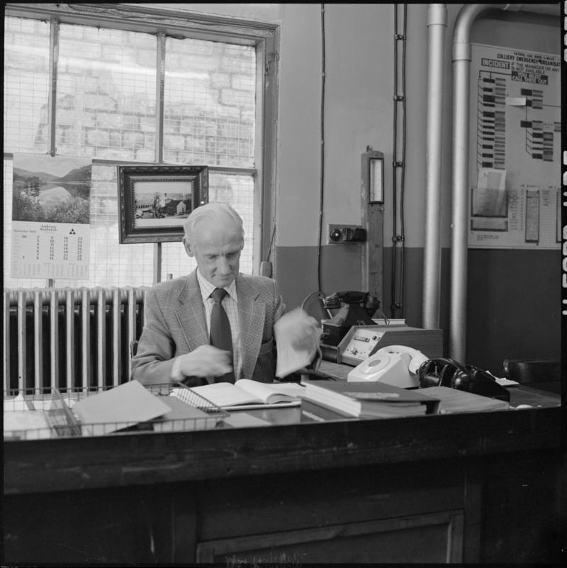 Black and white film negative showing Glyn Morgan, the last NCB manager, in his office, Big Pit Colliery 28 November 1980.  &#039;28 Nov 1980&#039; is transcribed from original negative bag.