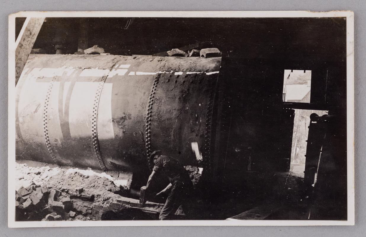 Breaking one of two Lancashire steam boilers out of its setting at Bryn Tinplate Works, Ynysmeudwy, 5 July 1934.