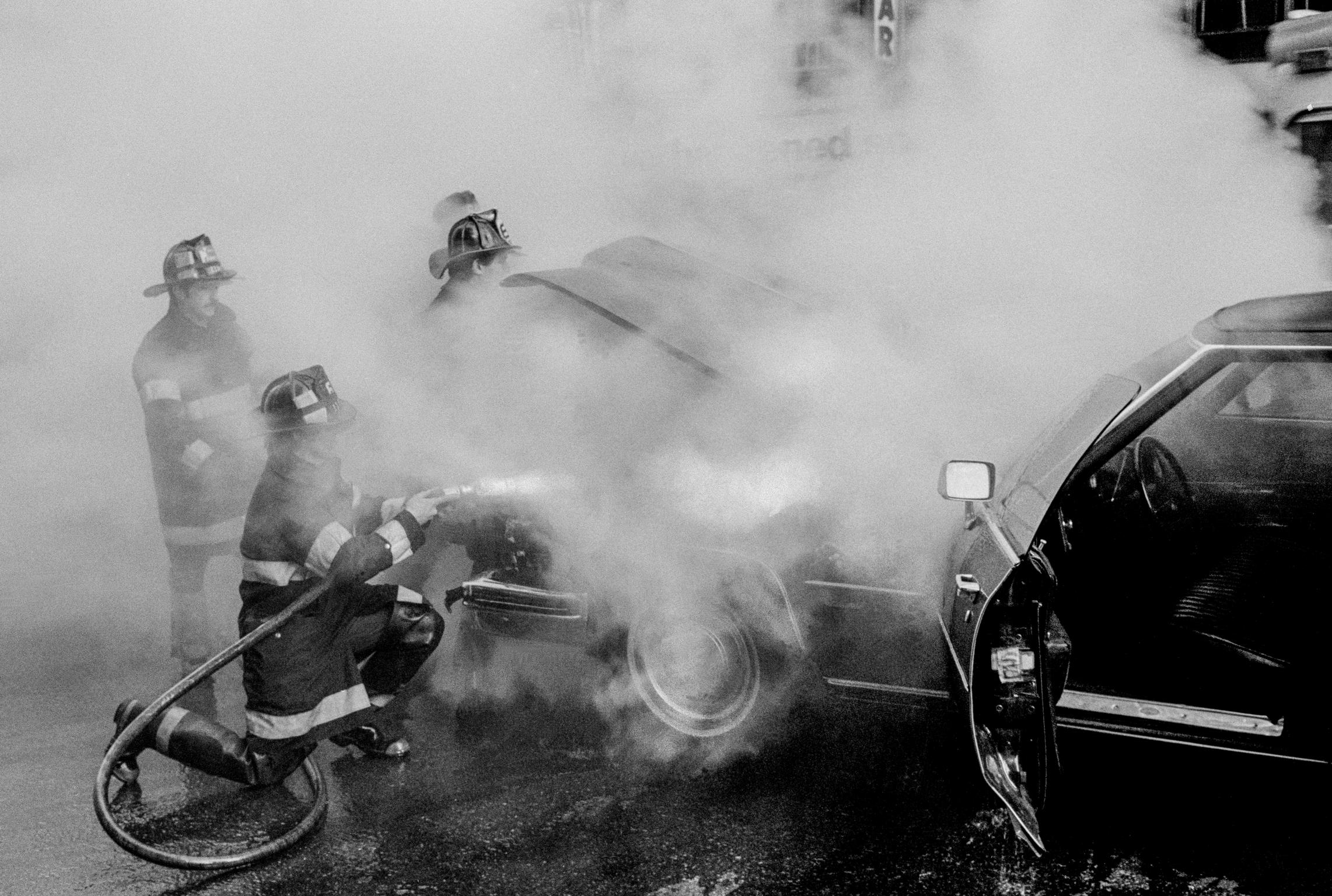 Car accident in the street. Firefighters come to the rescue. New York, USA