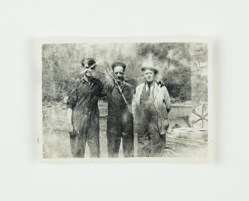 Slate quarryman from left are Arfon Jones (fitter), Elfed Davies (turner), Thomas Jones (fitter). Taken at Gilfach Ddu, Llanberis.