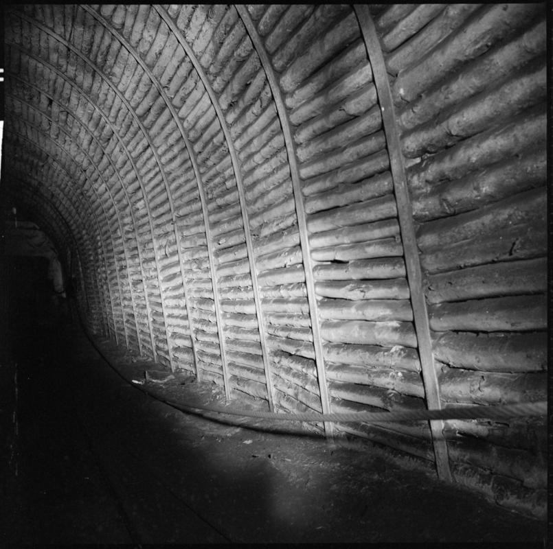 Black and white film negative showing an underground view, Tymawr Colliery 21 December 1976.  &#039;Ty Mawr 21/Dec/76&#039; is transcribed from original negative bag.