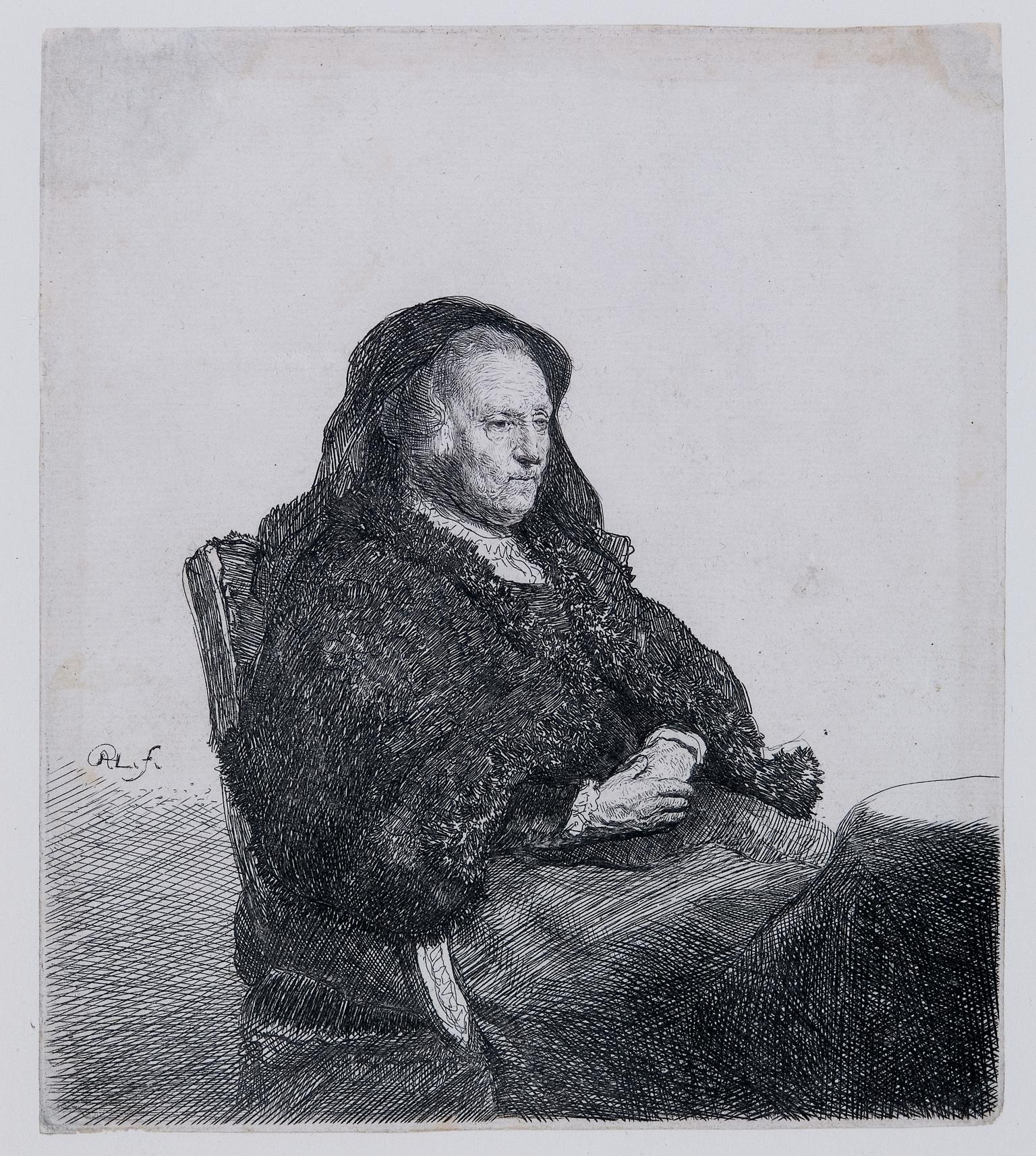 Rembrandt's mother seated at a table looking right