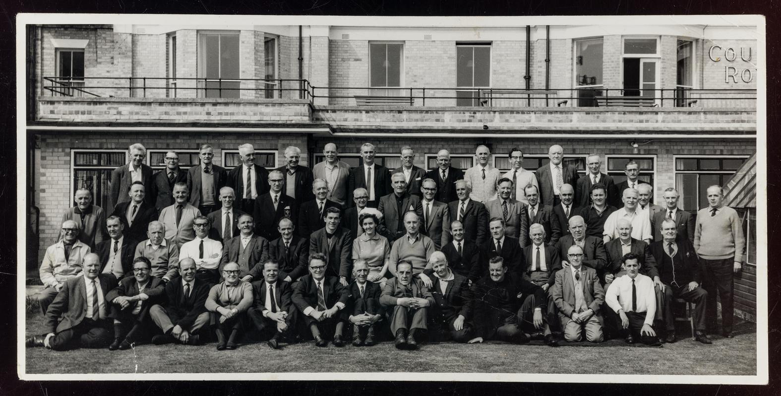 Black and white photograph showing large group of convalescing miners at Court Royal, Bournemouth, the convalescent home for the South Wales mining industry.