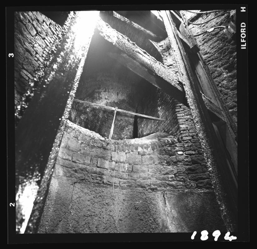 Black and white film negative showing the commencement of the air passage in the shaft, taken from the roof of the cage, Deep Duffryn Colliery 22 April 1980.
