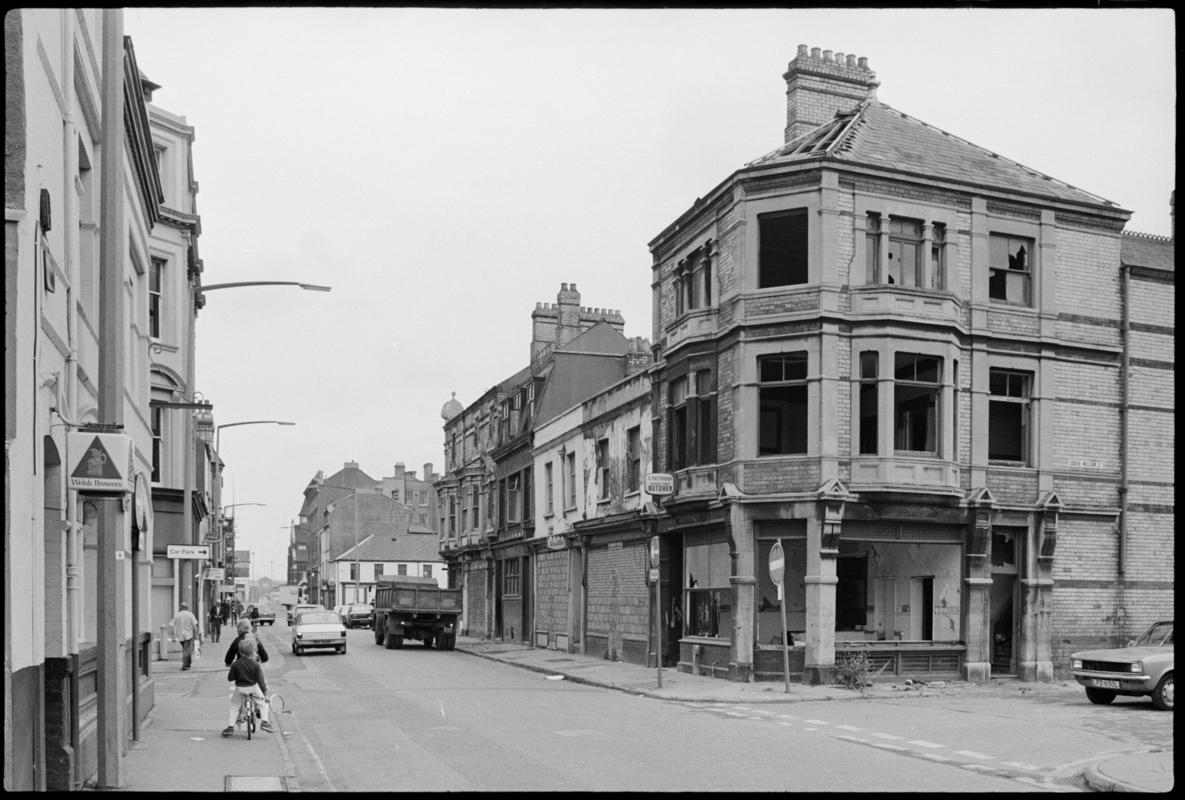 View looking east along James Street, Butetown. No.43, Patterson&#039;s butcher&#039;s shop lies derelict at the junction with South William Street.