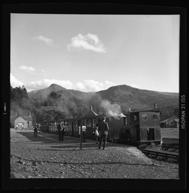 Steam engine and passenger carriages outside Llanberis Lake railway terminus, May 1975.