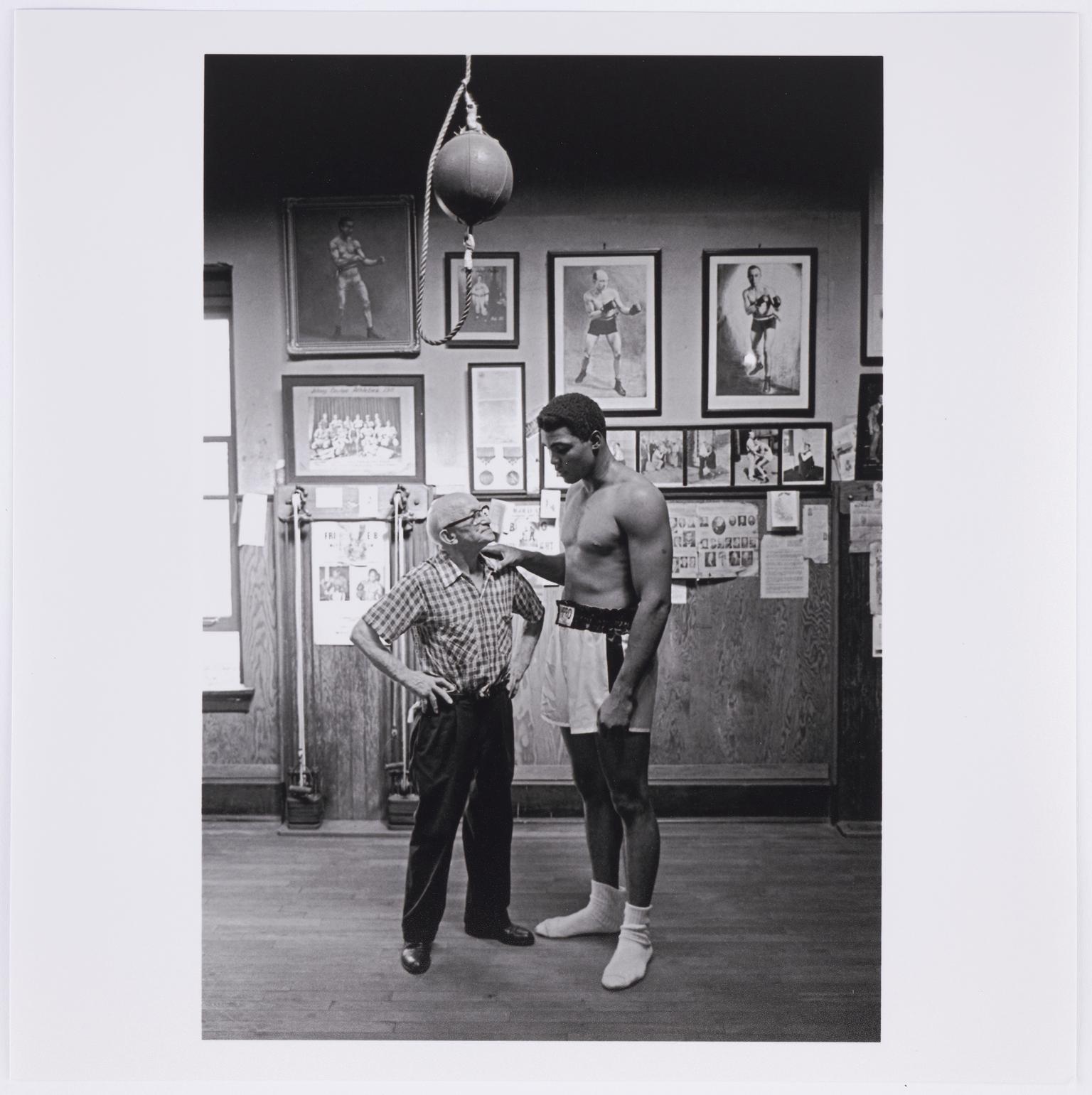 Muhammad Ali, boxing world heavy weight champion with Johnny Coulon, the world bantam weight champion of 1910, in his Chicago gym