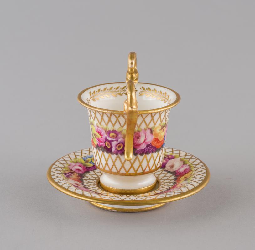 Cup, cabinet and saucer