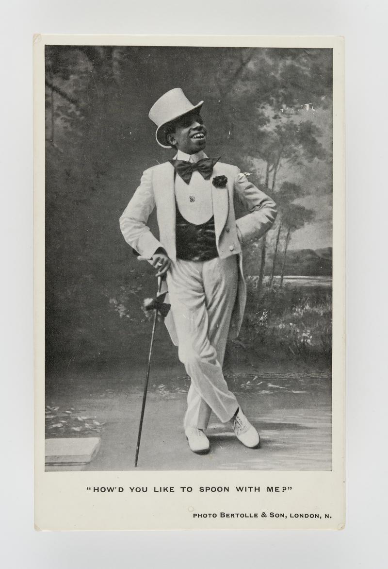 Photograph of a coloured minstrel (in white top hat &amp; tails). Title: &quot;How&#039;d you like to spoon with me?&quot;.  Posted in Whitland.