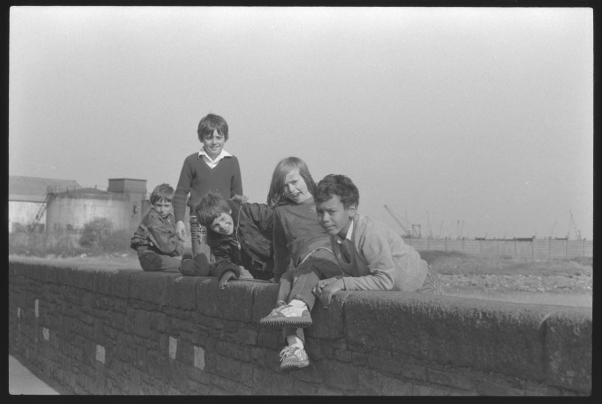 Children sitting on wall (foreshore) bordering Windsor Esplanade.