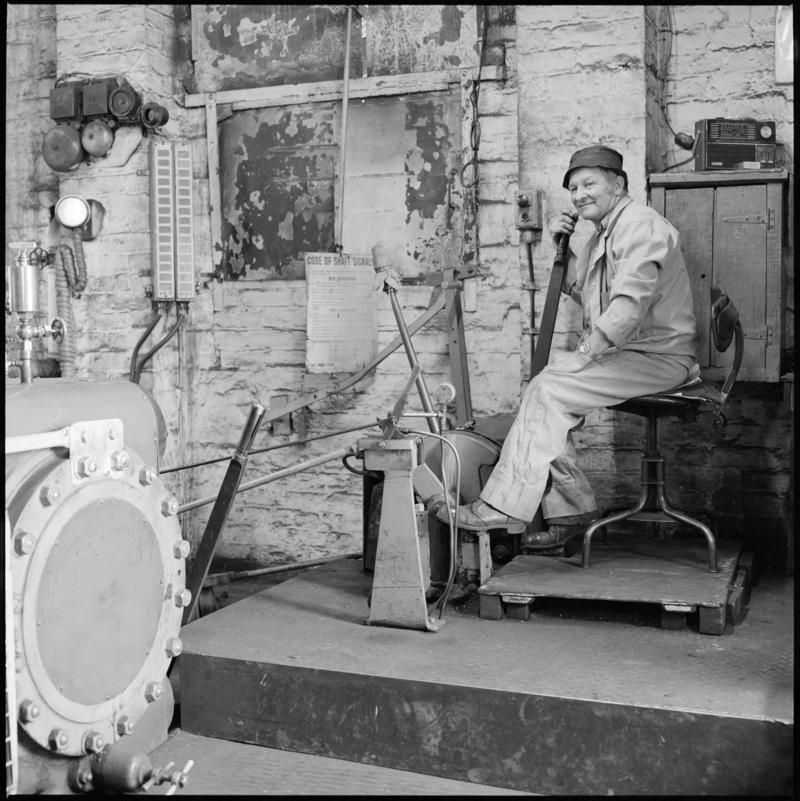 Black and white film negative showing a man operating the Andrew Barclay steam winder, Morlais Colliery 13 May 1981.  &#039;Morlais 13/5/81&#039; is transcribed from original negative bag.