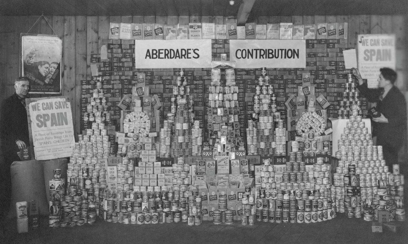 Aberdare&#039;s food contribution for child victims of the Spanish Civil War, with John Gentle on the left of the picture and Kalman Jones on the right.