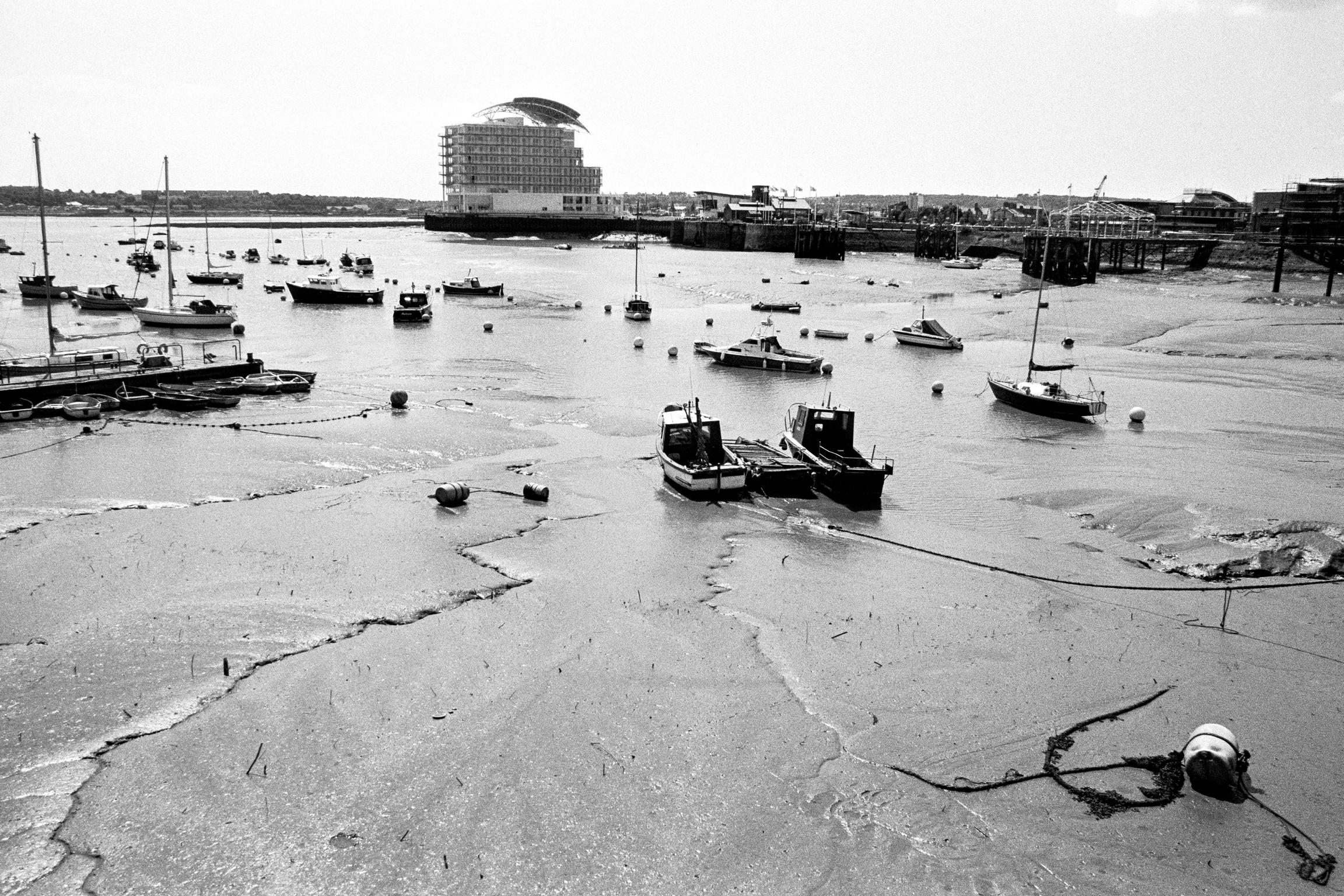 Golden patina on the polluted mud flats of the Bay before the Barrage construction. Cardiff, Wales