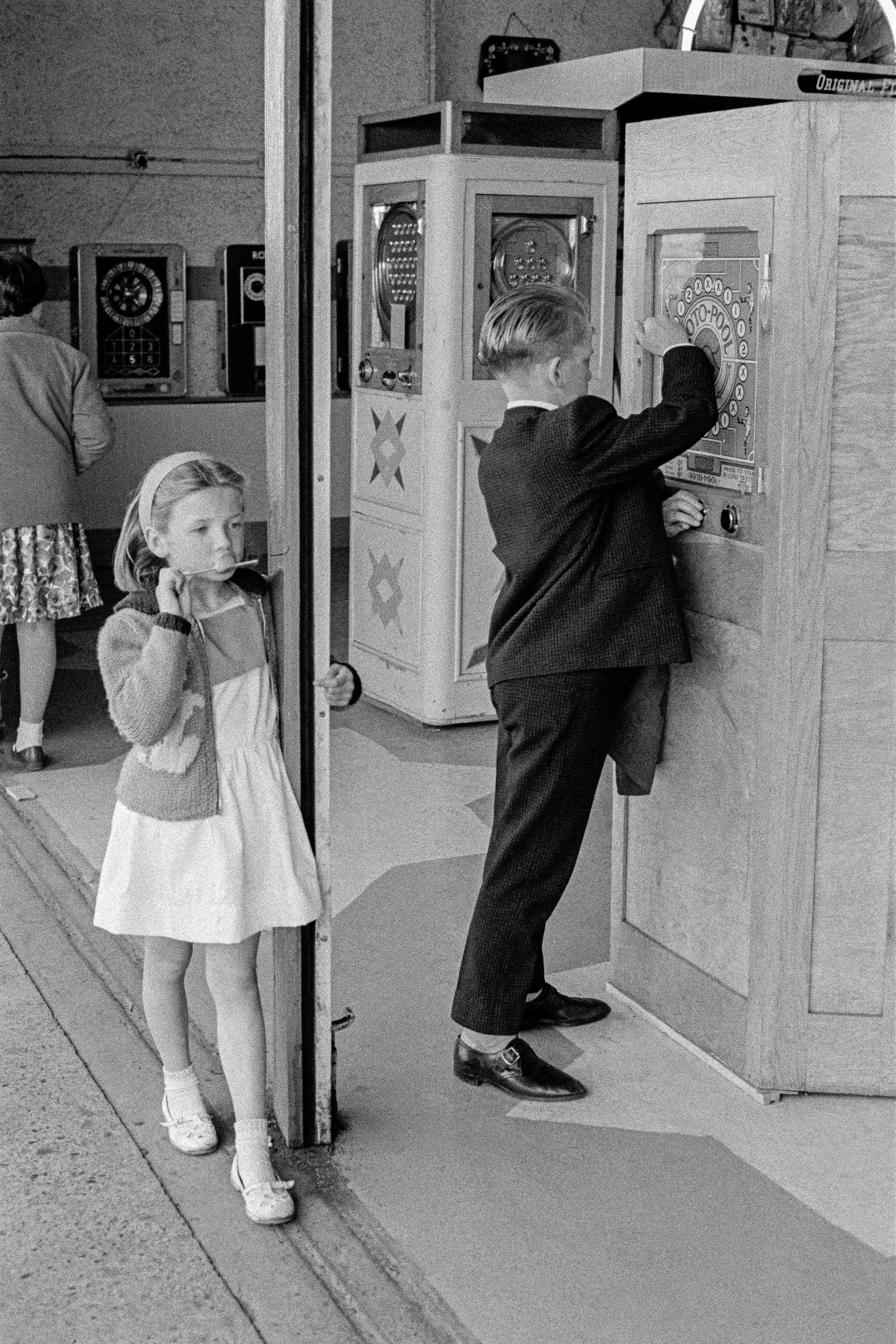 Children playing in the amusement arcade. Herne Bay, UK