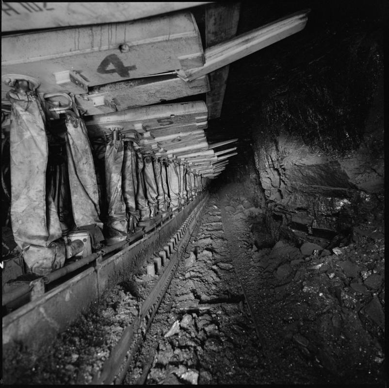 Black and white film negative showing chainless haualge on the face with Gullick Dobson powered supports, Betws Mine.  &#039;Betws&#039; is transcribed from original negative bag.