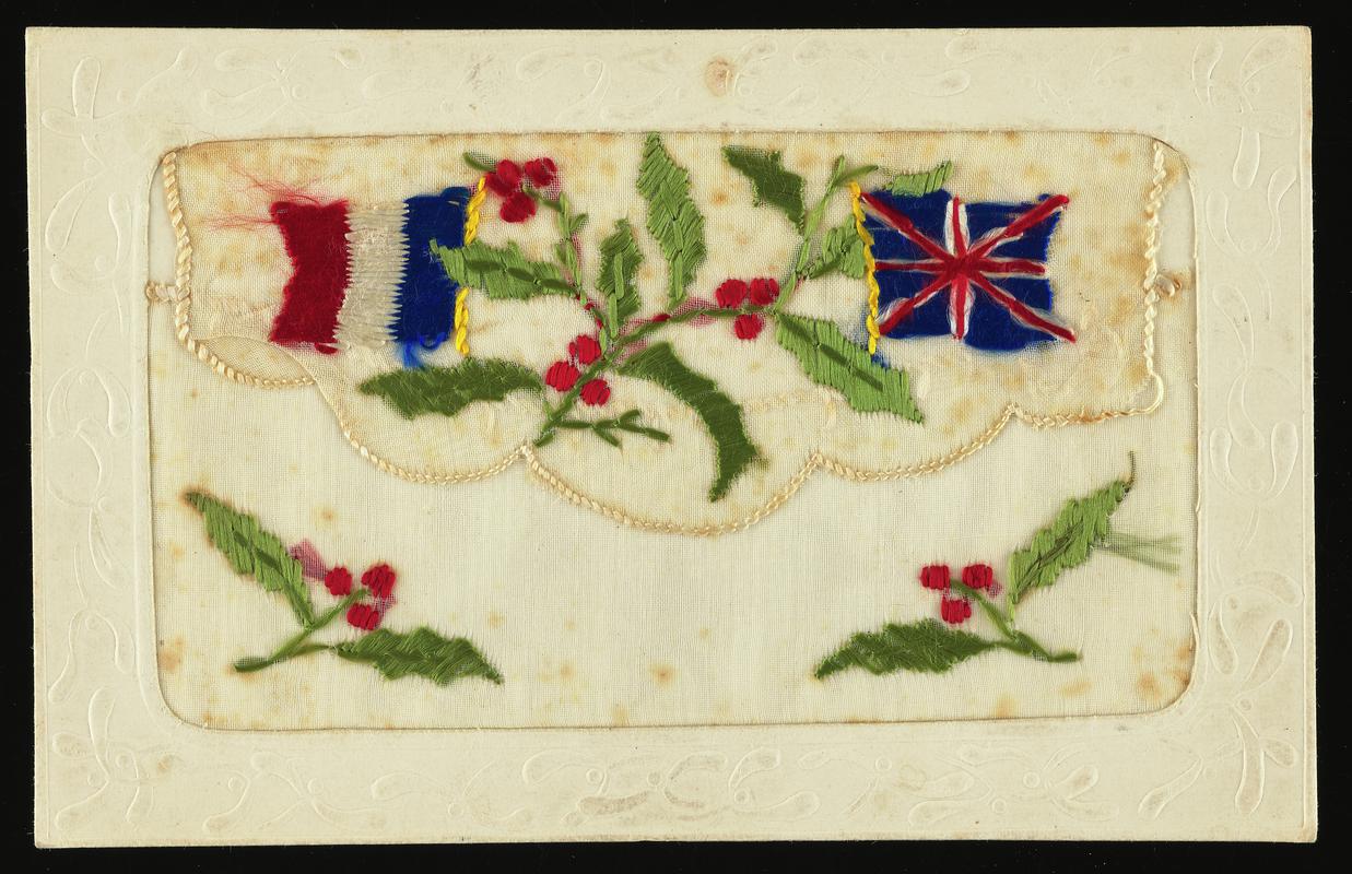 Embroidered postcard. Handwritten message on back. Sent to Miss Mona Hussey, from her brother Corporal Hector Hussey of the Royal Welch Fusiliers, during the First World War.