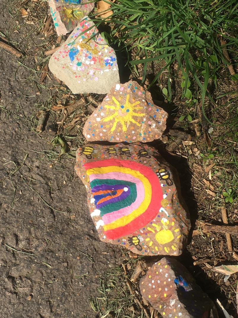 Detail of painted pebbles in Castle Dell, Chepstow, Monmouthshire.