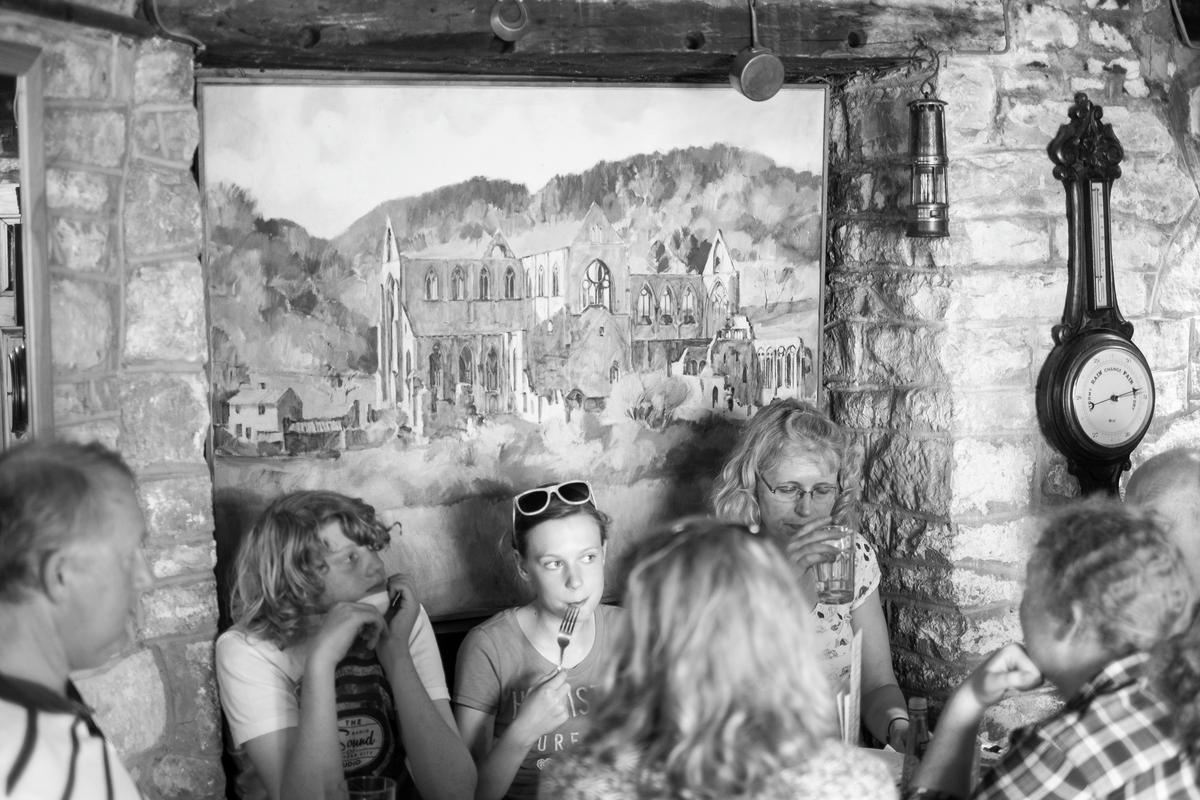 GB. WALES. Tintern. During the Folk Festival. The White Monk cafe. 2014.