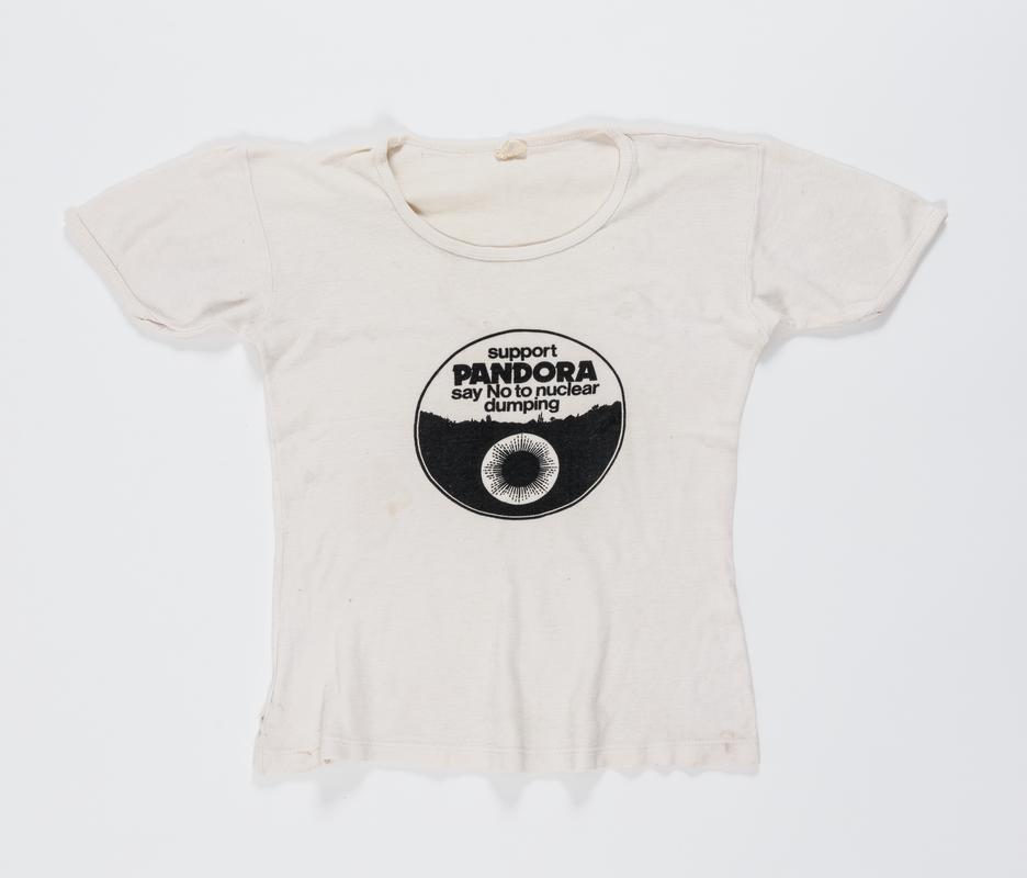 White t-shirt with logo and inscription on front: &#039;support Pandora say No to nuclear dumping&#039;. Worn by Thalia Campbell, late 1970s.