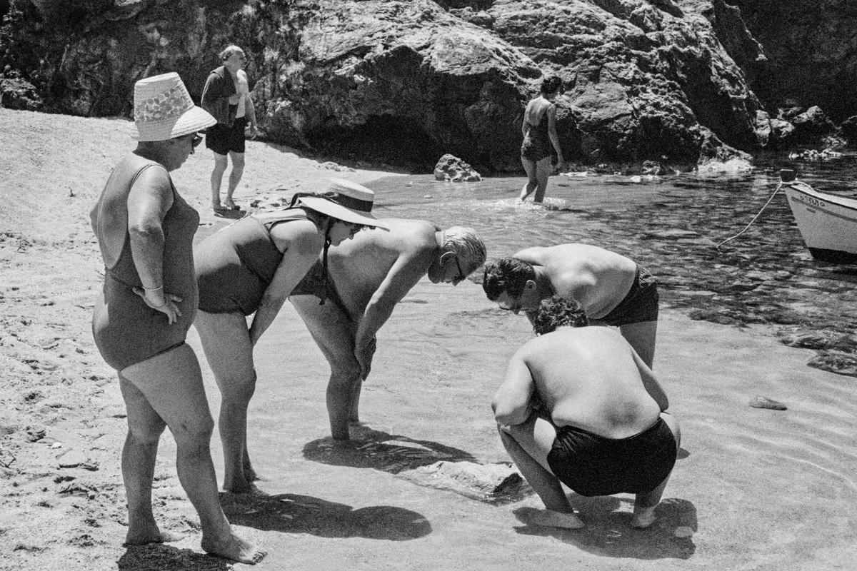 GREECE. Corfu. Paleokastritsa. Examining the beach. 1963