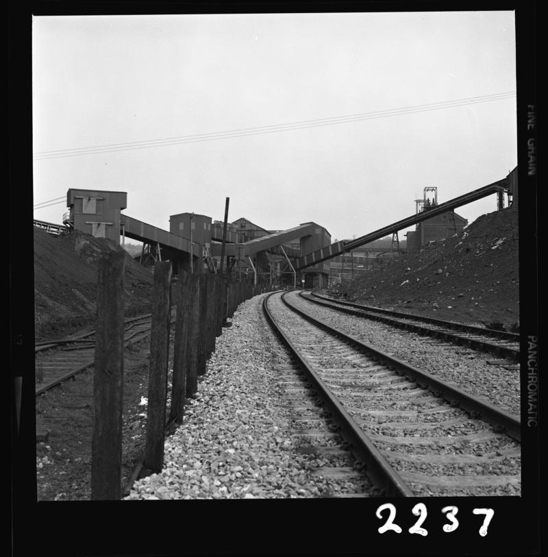 Black and white film negative showing a surface view of Oakdale Colliery taken from the rail track, 16 April 1981.  &#039;Oakdale 16 Apr 1981&#039; is transcribed from original negative bag.  Appears to be identical to 2009.3/1750.