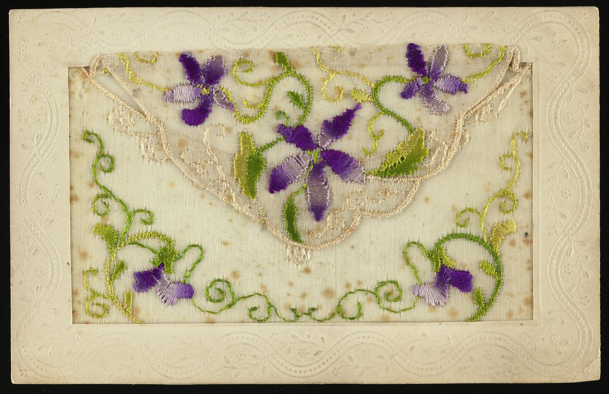 Embroidered postcard. Handwritten message on back. Sent to Miss Evelyn Hussey, from her brother Corporal Hector Hussey of the Royal Welch Fusiliers, during the First World War.
