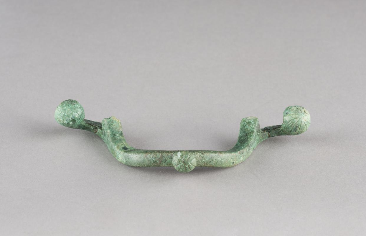 Roman copper alloy handle from bowl
