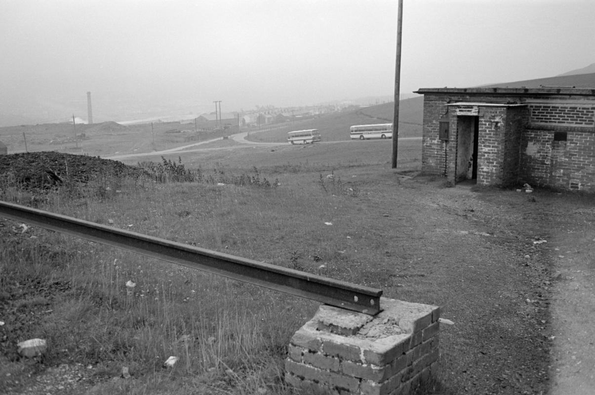 Powder magazine entrance, Big Pit Colliery, with buses approching in distance.