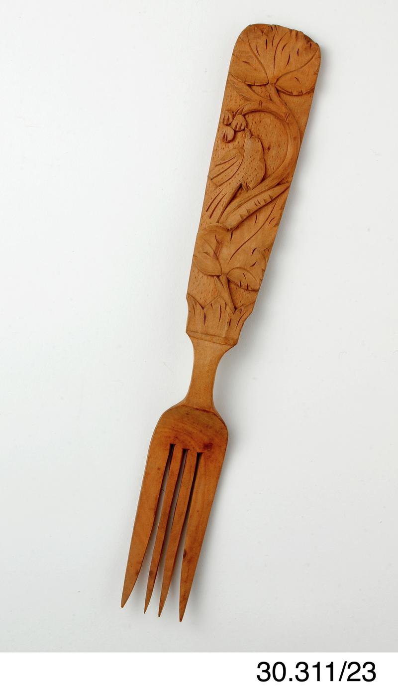 Carved fork, part of set