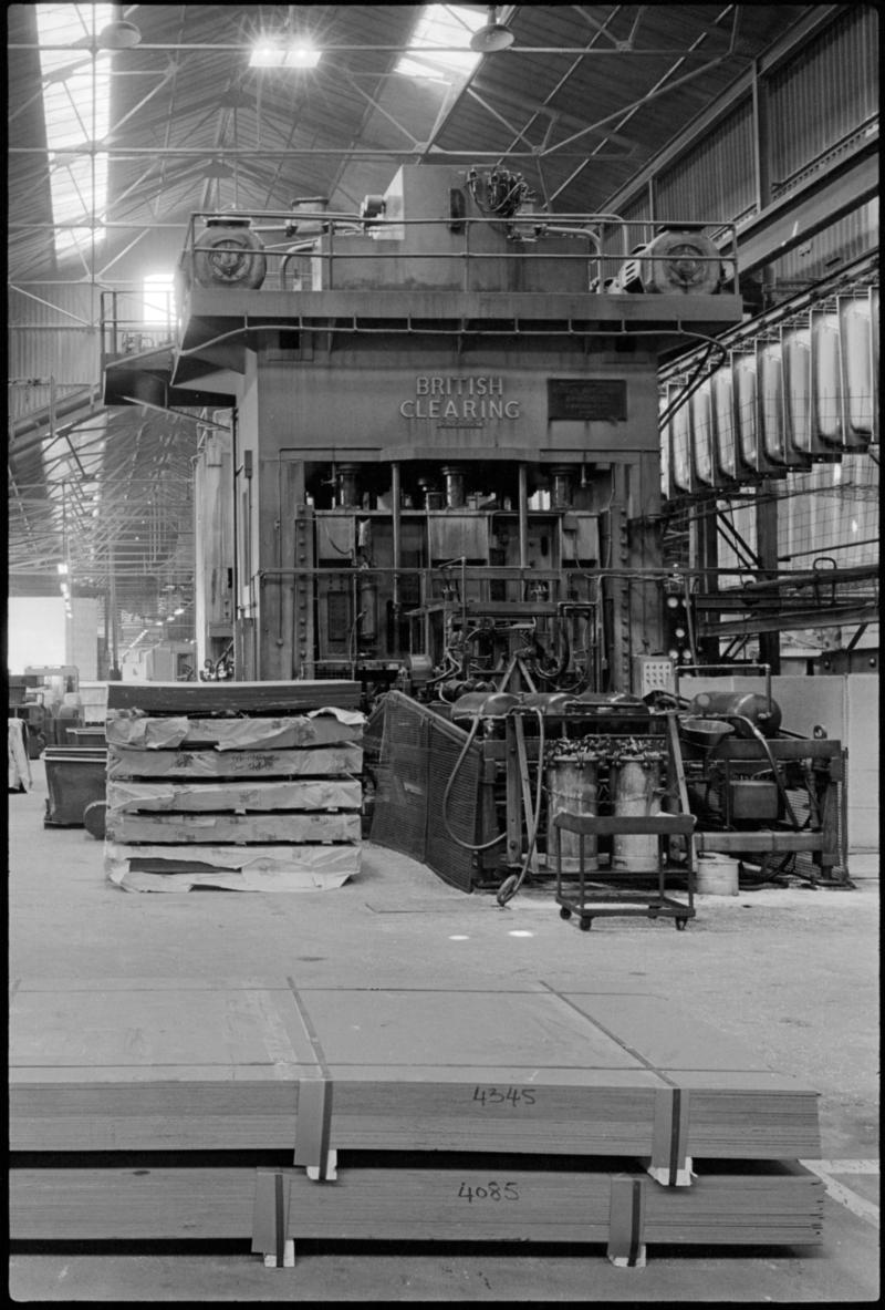 Interior view of Edward Curran Engineering Ltd premises, Cardiff Docks, showing a press for making baths.