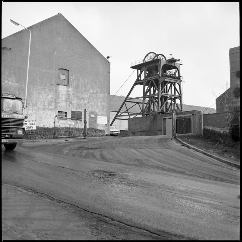 Black and white film negative showing a view of a headframe, Cwm Colliery, April 1981. &#039;Cwm&#039; is transcribed from original negative bag.