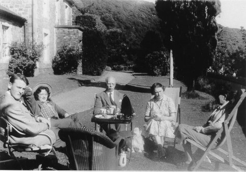 Dinorwig Quarry Hospital. Vivian Hughes and his family having afternoon tea outside DQH, 1957. Vivian Hughes on left, Annette de Wulf (cousin), Griffith Samuel Hughes, Marie Therese Hughes, Gladys de Wulf. Note that a flag pole can been seen on the lawn outside DQH.