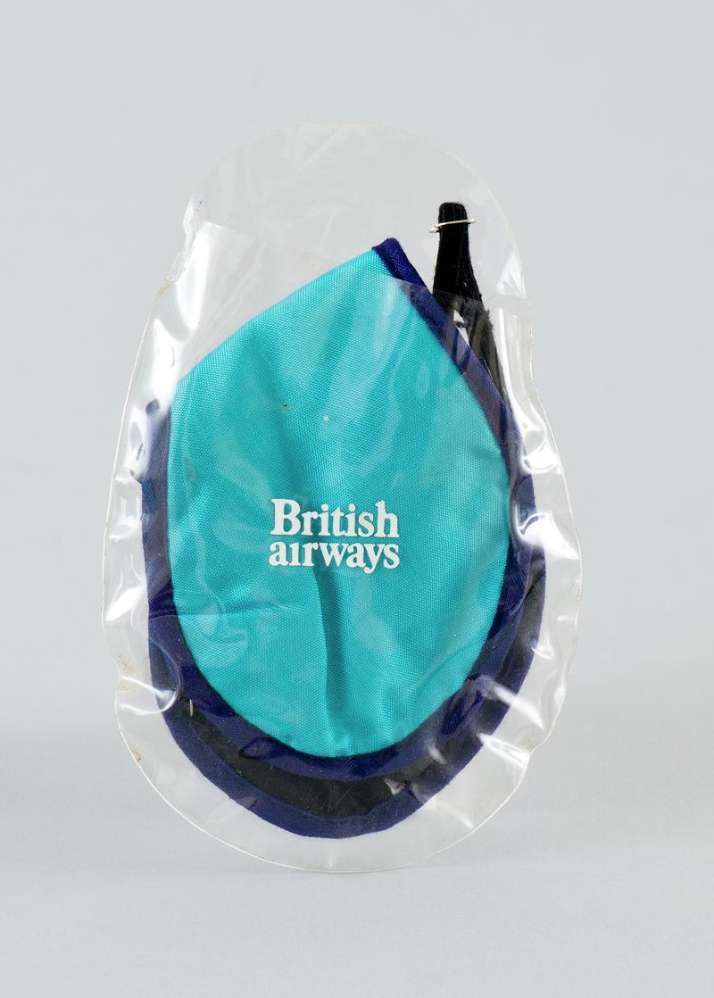 British Airways&#039; blue eye cover with adjustable elasticated band in plastic pouch.