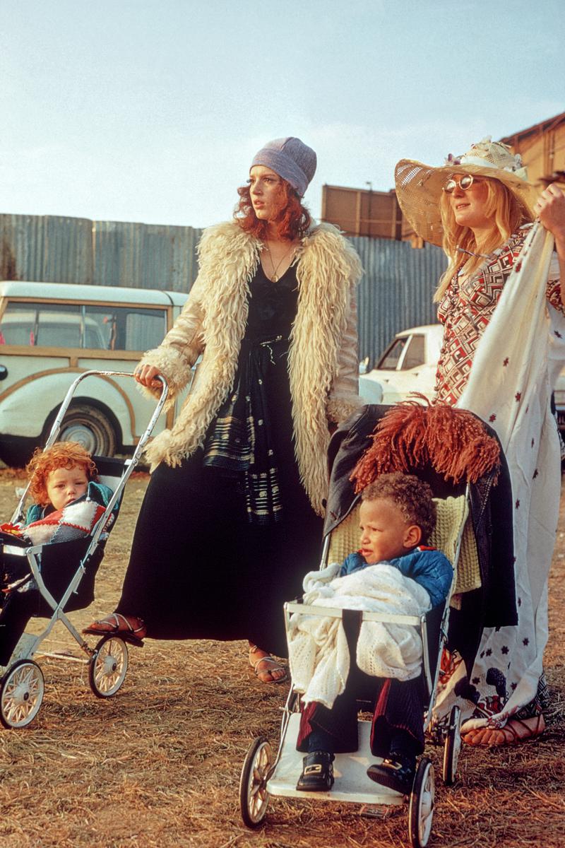 GB. ENGLAND. Isle of Wight Festival. Affluent mothers posing with their children in the VIP backstage area. 1969.