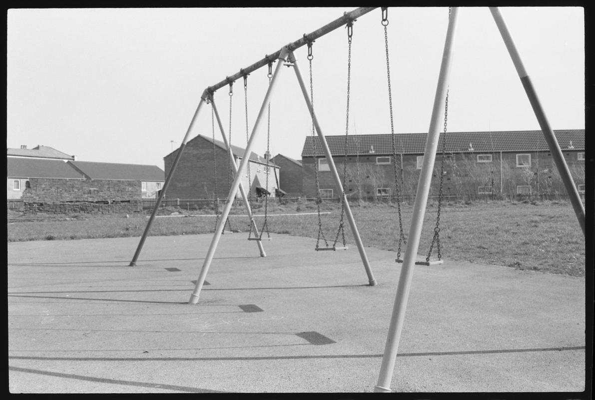 Swings in children&#039;s playground, on site of old canal.