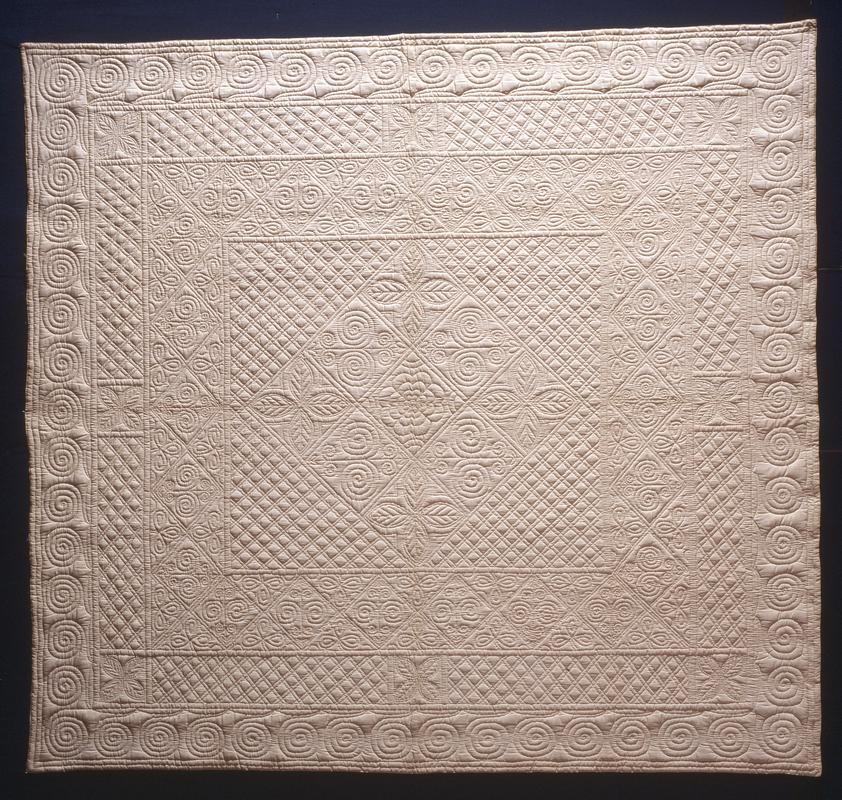 Cream cotton quilt made by Porth quilting group, 1933