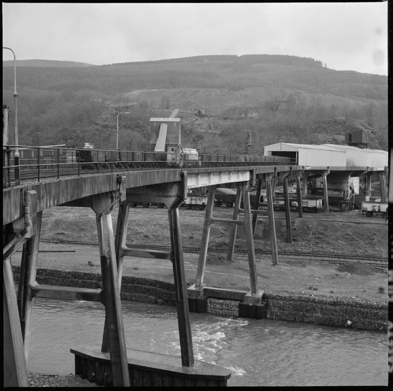 Black and white film negative showing a concrete viaduct spanning the river linking the mine with the washery, Blaengwrach Colliery 1978.  &#039;1978&#039; is transcribed from original negative bag.
