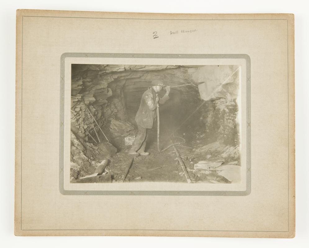 Photograph showing Stan Williams&#039; dust trap invention in action underground. Mounted on card.