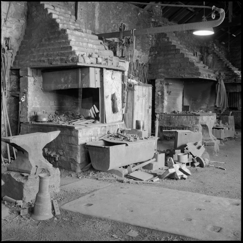 Black and white film negative showing the interior of the blacksmith workshop, Big Pit Colliery 1975.  &#039;Blaenavon 1975&#039; is transcribed from original negative bag.