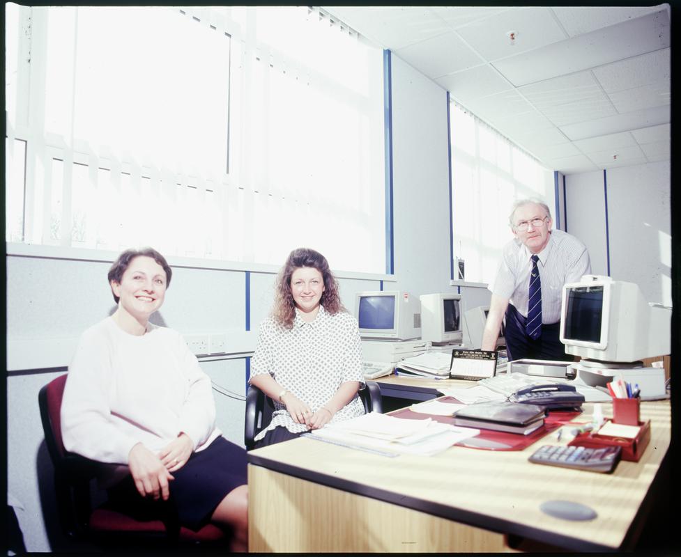 Three members of staff in offices at Metal Box factory, Neath.