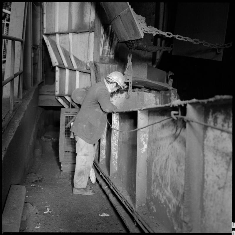 Black and white film negative showing a man at a transfer point, Betws Mine.  &#039;Betws&#039; is transcribed from original negative bag.