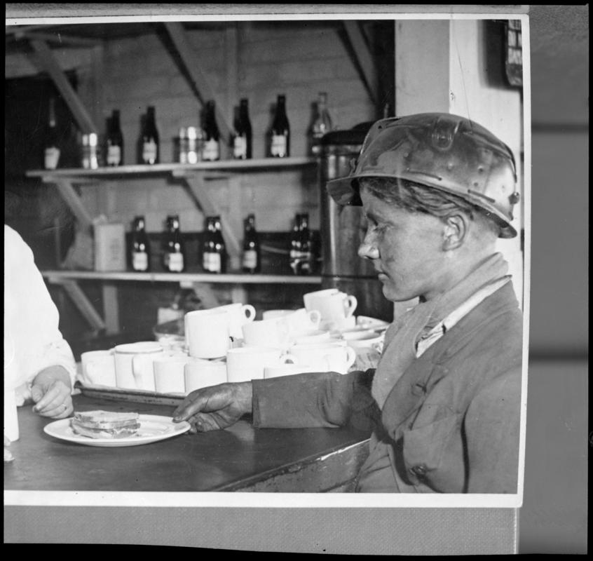Black and white film negative of a photograph showing a Bevin Boy in the canteen, unknown colliery.  &#039;Bevin Boy&#039; is transcribed from original negative bag.
