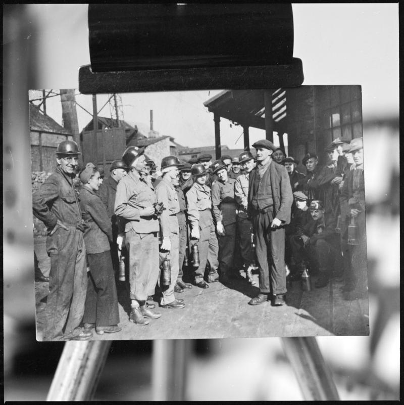 Black and white film negative of a photograph showing a group of miners on the surface, Deep Navigation Colliery.  &#039;Deep Navigation&#039; is transcribed from original negative bag.  Appears to be identical to 2009.3/3051.