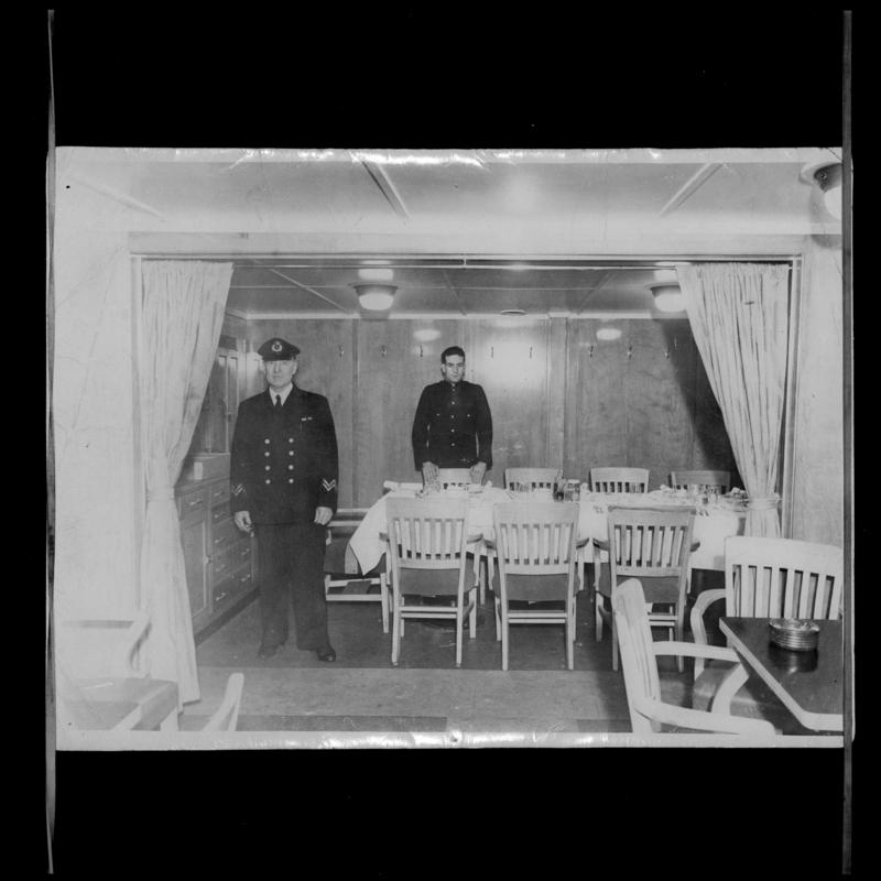 Chief and Assistant Steward in officers saloon on the S.S. OCEAN VANGUARD.