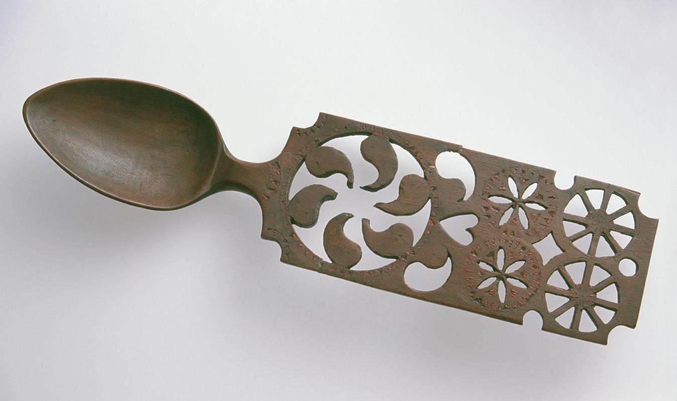 Lovespoon with panel handle and chip-carving filled with red wax