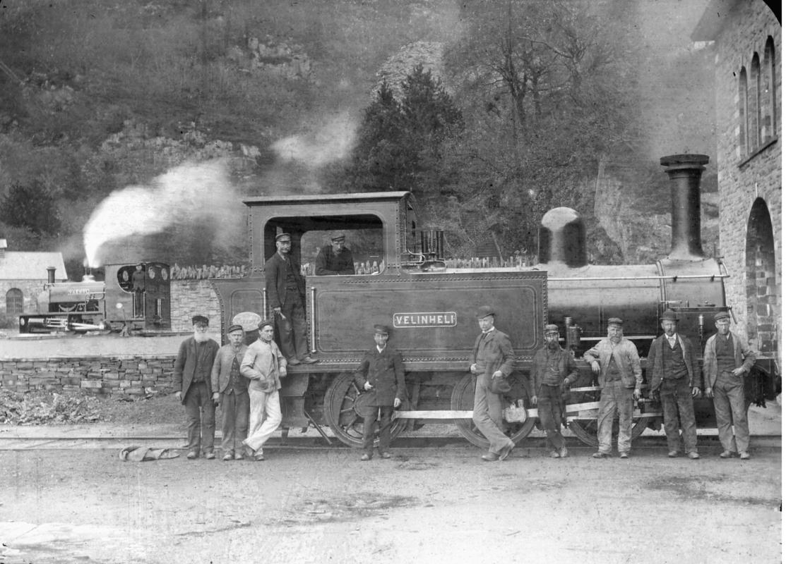 View of the steam locomotive &#039;Velinheli&#039; outside the Gilfach Ddu workshops, with the narrow gauge steam locomotive &#039;Vaenol&#039; (later re-named &#039;Jerry M&#039;) in the background